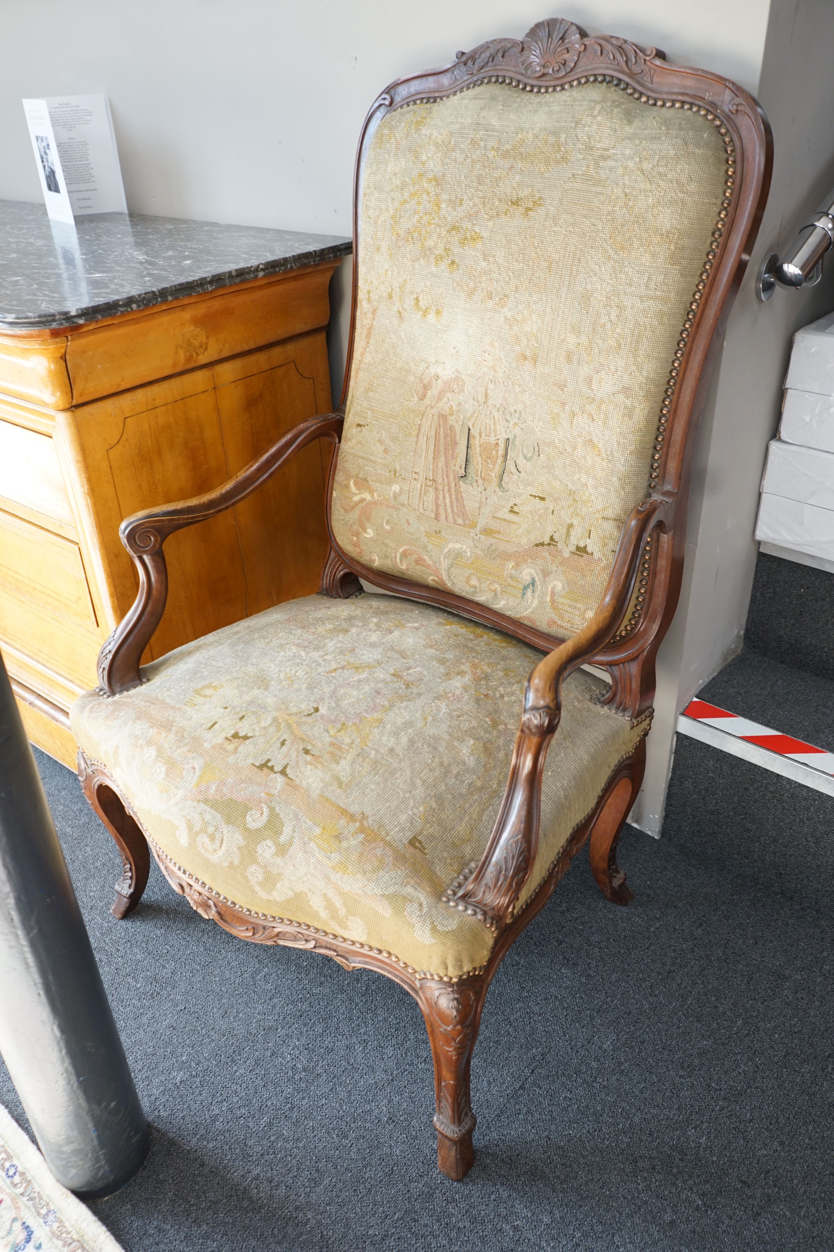 A pair of French carved walnut fauteuils with tapestry upholstery, width 75cm, depth 62cm, height 120cm